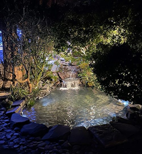 slate paddle stone pond at night